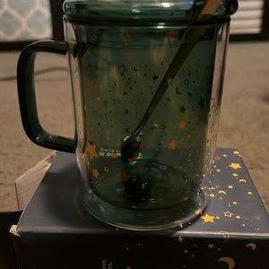 Blue and gold mug with stars and small spoon